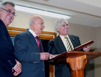 Judge Federico A. Moreno, right, chief judge of the U.S. District Court, Southern District of Florida, receives the "Lex Christi, Lex Amoris" award from Chief U.S. Magistrate Peter R. Palermo during a reception following the Red Mass. At left is attorney Jose I. Rojas, president of the Miami Catholic Lawyers Guild.