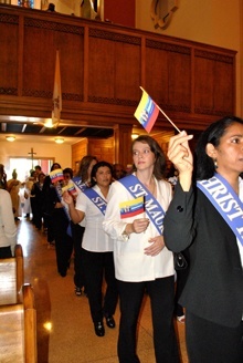 Members of La Cofradía de Nuestra Señora de Chiquinquirá enter St. Mary Cathedral wearing sashes bearing the names of the parishes to which they belong. The cofradía, or guild, is present in 30 parishes in the Archdiocese of Miami.