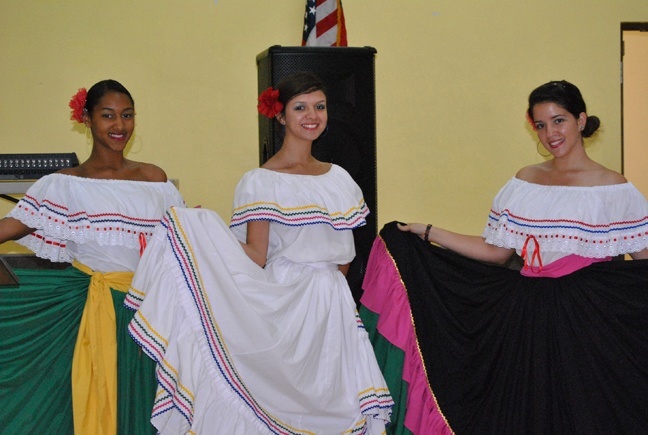 Colombian dancers, from left, Cynthia Baez, Ana Guerrero and Giuliana Toscani, show off their folkloric outfits.