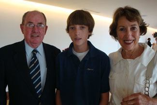 Tom and Judy Maus, St. Thomas Aquinas class of 1953, pose with their grandson, Joey Maus, class of 2014, after the Mass marking the school's 75th anniversary.