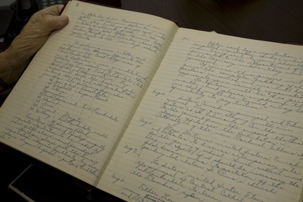 Sister Marie Schramko shows the neatly-handwritten pages of the journal she has kept every year since 1961, when she arrived to staff the girls' side of Cardinal Gibbons High School. "Someday they'll want to know how we started," she thought.