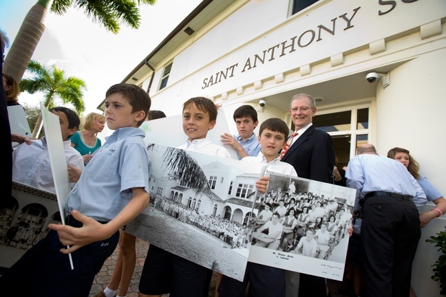 Children and adults prepare to process into the anniversary Mass for St. Anthony Parish and School.