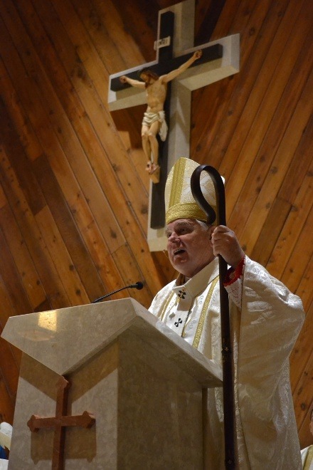 Archbishop Thomas Wenski speaks at the consecration Mass for the new altar in the chapel of St. Brendan Church.