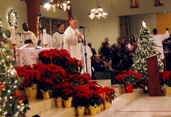 Archbishop Thomas Wenski celebrated a traditional midnight Mass to bring in the New Year at Notre Dame d’ Haiti Mission in Little Haiti; several archdiocesan priests and members of the community filled the church.