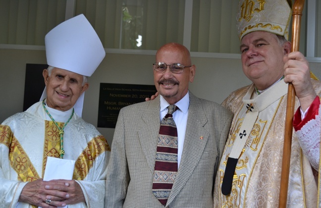 Brother Marcelino Coto, one of the Christian Brothers de la Salle who, after being expelled from Cuba, helped found La Salle High School in Miami, poses for a picture with retired Miami Auxiliary Bishop Agustin Roman and Archbishop Thomas Wenski. Brother Coto died this past week.