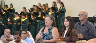 Taking up the offertory at the Mass, from left: Valeria Guzman, her daughter, Vanessa Guzman, Immaculata-La Salle class of 2009, and her father, Sergio J. Guzman, La Salle class of 1972.