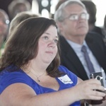 Roisin Ferry, a niece of Msgr. Bryan O. Walsh, tapes the talk of her brother during the conference.