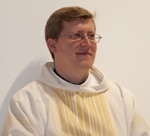 Father Emanuele De Nigris, newly-appointed pastor of St. Cecilia, takes part in the Mass.