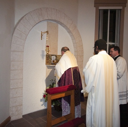 Archbishop Thomas Wenski put the consecrated hosts in the tabernacle at the end of the Mass.