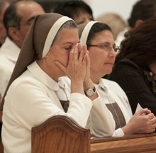 Mother Adela Galindo, founder of the Servants of the Pierced Hearts of Jesus and Mary, and her fellow religious, Sister Ana Margarita Lanzas, pray during the Mass.