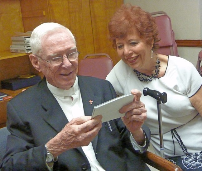 Jesuit Father Thomas Griffin is seen here with retired nurse and dear friend, Dorothy Janine Butler, who flew in from Atlanta for his farewell Mass.