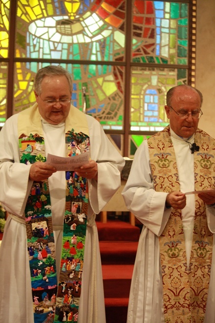 Rev. Burt H. Froehlich of Key Biscayne Episcopal Church and St. Agnes' pastor, Father Jose L. Hernando, right, recite the prayer of consecration.