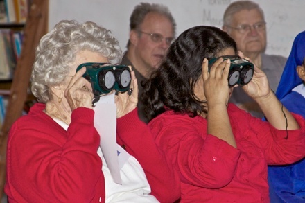Mildred Phelps, left, and Lorena Gomez wear simulator goggles during the sensitivity training program at St. Clement.