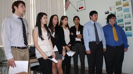 One of the 86 different groups of Immaculata-LaSalle students prepare to make their presentation on their SIAW project to a panel of teacher-judges. They leave their uniforms at home and dress in professional attire for their presentation.