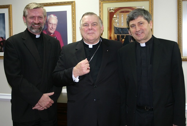 Archbishop Thomas Wenski meets with Father Christopher Wielizcko, right, director of the John Paul II Foundation in Rome, and Father Klemens Dabrowski, Society of Christ, pastor, Our Lady of Czestochowa Mission, Pompano Beach, on March 29 at the Pastoral Center of the Archdiocese of Miami.