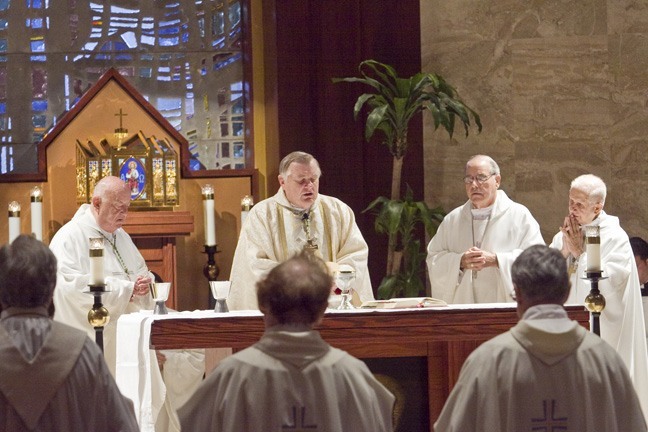 Archbishop Wenski and his fellow Miami bishops celebrate the Mass; from left: Archbishop Emeritus John C. Favalora, Bishop Felipe Estevez and retired Auxiliary Bishop Agustin Roman.