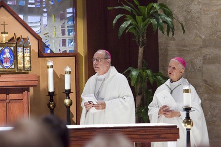 Bishop Felipe Estevez, left, with his friend and mentor of more than 40 years, retired Auxiliary Bishop Agustin Roman, celebrate the Mass.