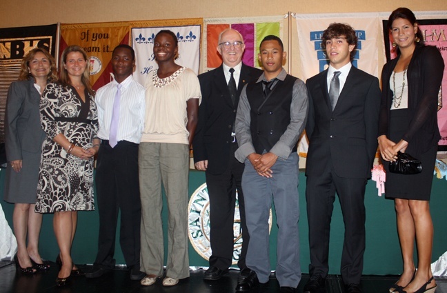 From left to right: Isabel Lopez-Healy, St. Brendan assistant principal for administration; Mia Suarez, assistant principal for academics; swimmers Wayne Denswil and Evita Leter from Suriname; Brother Felix Elardo, St. Brendan principal; Jair Jestyn Tjon En Fa, a cyclist from Suriname; Victor Carbone, a race car driver from Brazil; and swimmer Karlene Van Der Jagt from Suriname.