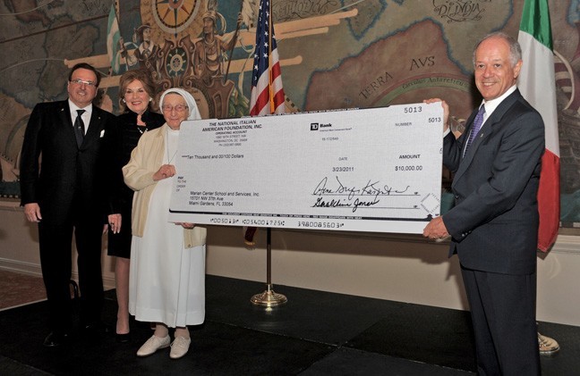 Arthur J. Furia, far left, National Italian American Foundation general counsel and a partner at Shutts & Bowen LLP, and Italys Consul General in Miami, Marco Rocca, right, present the ,000 donation to the Marian Center to Sister Lucia Ceccotti of the Sisters of St. Joseph Benedict Cottolengo.