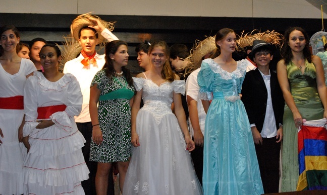 Members of the eighth grade class of  Sts. Peter and Paul School take a bow at the end of their play based on the Cuban-American television show, "Que Pasa USA?"