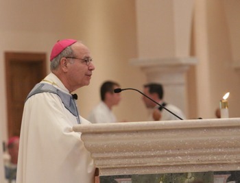 Bishop Estevez delivers his homily from the ambo at the St. Joseph's Catholic Church in Jacksonville during his installation Mass.