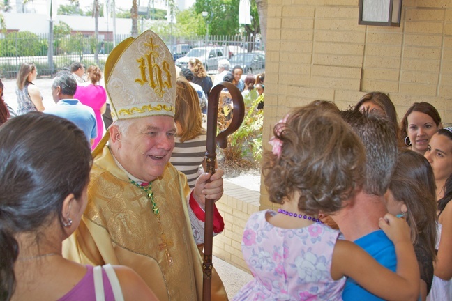 Archbishop Wenski greets Corpus Christi parishioners after Mass.