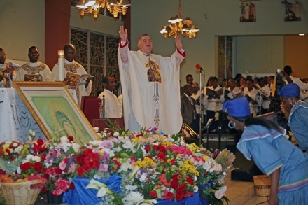 Archbishop Wenski speaks to the congregation - many of them his former parishioners - during the Mass.