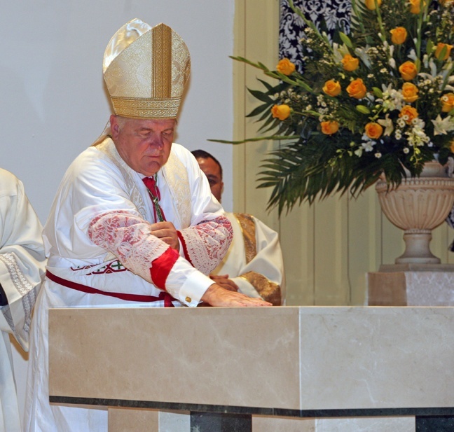 Archbishop Thomas Wenski anoints the new altar with the oil of chrism.