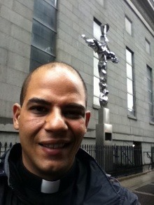 Father Luis Rivero at the Memorial Cross outside St. Peter Church near Ground Zero.