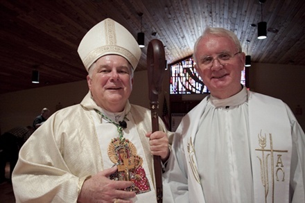 Archbishop Thomas Wenski poses with Msgr. Vincent Kelly after the Mass with school principals in honor of Msgr. Kelly's 35 years of work in the Office of Faith Formation. He is retiring from his role at the archdiocesan level, but will continue to serve as supervising principal of St. Thomas Aquinas and Cardinal Gibbons high schools in Fort Lauderdale, as well as pastor of St. John the Baptist Parish.