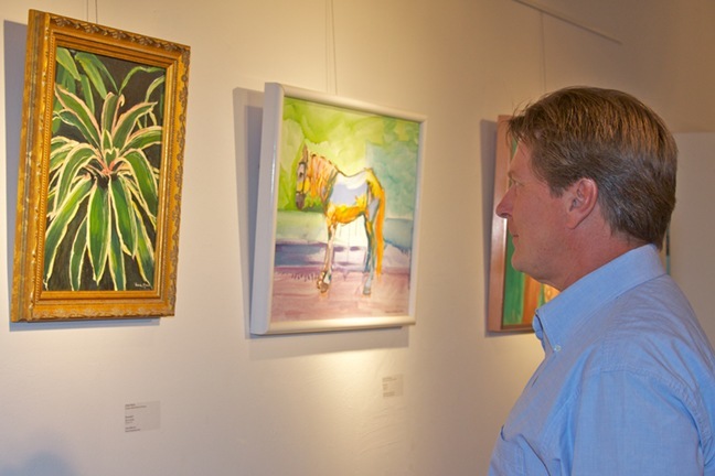 Don Hanson views the "Teaching Artists - A Catholic Tradition" exhibit on opening night at the Archbishop Curley Notre Dame High School Gallery of Art.