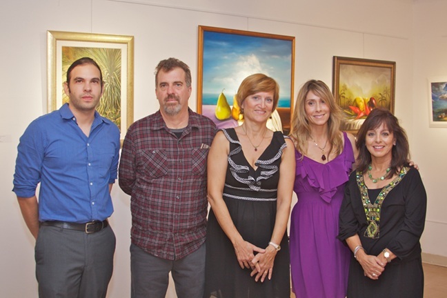 From left, Broward and Miami-Dade Catholic school teachers and artists Yunier Cervino Oliver, Kerry Ware, Catherine Wichmann, Vivian Macia, and Wilma Devoe, whose artwork is represented at the "Teaching Artists - A Catholic Tradition" exhibit at Archbishop Curley Notre Dame High School's art gallery.
