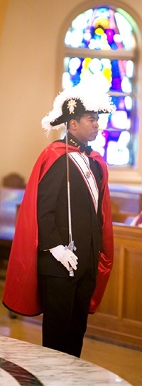 Knight of Columbus Kevin Corke from St. Louis Parish stands guard at the funeral for Miami Auxiliary Bishop Gilberto Fernandez in 2011.