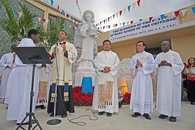 St. Helen's parochial vicar, Father Robert Ayala, speaks during the dedication ceremony for the new statue. With him, from left, Father Joseph Long Nguyen, Vietnamese Apostolate administrator, Deacon Viet Nguyen and Deacon Edualdo Desmornes of St. Clement Parish.