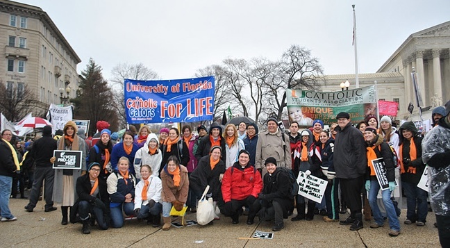 The pilgrimage troupe poses near the Supreme Court upon finishing the march.