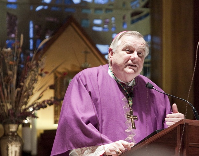 Archbishop Thomas Wenski speaks to directors of religious education during the Mass that took place as part of their day-long meeting.