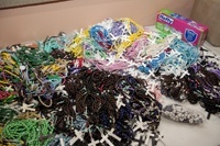 The rosaries, made by volunteers throughout the country, come in packs of 10.