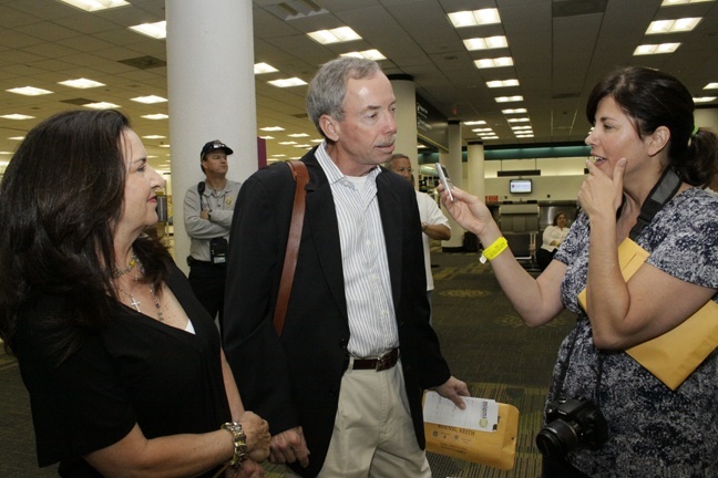 Teresa Peterson, communications director for the Diocese of Orlando, interviews Keith Koenig and his wife, who are on the Cuba pilgrimage. He is owner of City Furniture and has donated mattresses for the pope to sleep in while in Cuba.