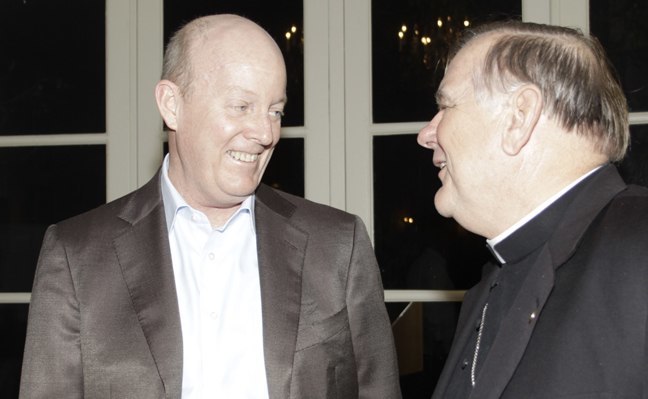 Archbishop Thomas Wenski speaks with John Caulfield, chief of the U.S. Interests Section in Havana.