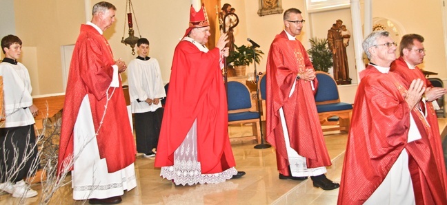Archbishop Thomas Wenski processes out of the minor basilica of St. Mary Star of the Sea after celebrating the annual Red Mass for those in the legal profession in Monroe County. Accompanying him, from left, are: Deacon Peter Batty and Father John Baker, pastor, of St. Mary Star of the Sea in Key West; Father Gerald Morris, pastor of San Pablo in Marathon; and Father Henryk J. Pawelec, administrator of San Pedro in Tavernier.