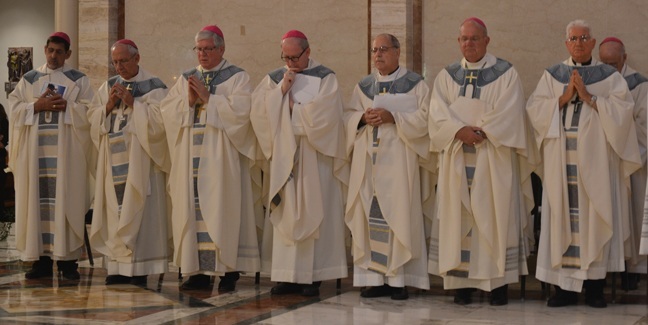 Bishops from Cuba and Florida take part in the funeral Mass for Bishop Agustin Roman. From left: Bishop Mario Mestril of Ciego de Avila, Bishop Emilio Aranguren of Holguin, Bishop Frank Dewane of Venice, Bishop John Noonan of Orlando, Bishop Felipe Estevez of St. Augustine, Bishop Robert Lynch of St. Petersburg and Archbishop Dionisio Garcia of Santiago de Cuba.