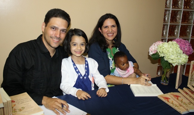 Carmen Santamaria with her husband Alejandro, and their daughters Monica, 6, and Victoria, 8 months.