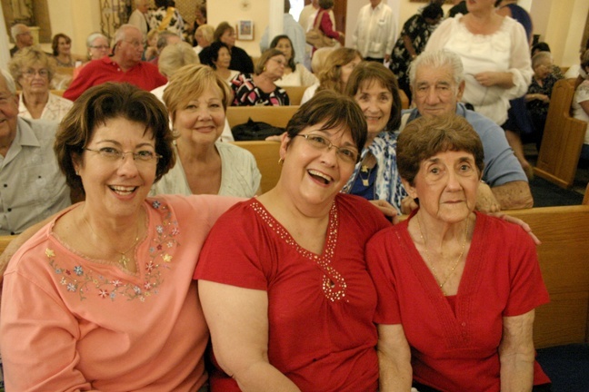 Joyce Griffin, left, sat in her pew at 9:30 a.m. to make sure she held the space for her sister, Carlene Wiseman, center, and their mother, Mary Griffin, 90. All three, and other members of their families, received all their sacraments at St. Mary Star of the Sea Church, where they have been parishioners for decades. Behind them are other longtime parishioners who also received all their sacraments at the new basilica: from left, Gloria Balbontin, 72, Anita Woodruff, 81, and Joe L. Perez, 83.