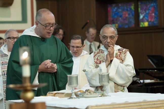 Dominican Father Jorge Presmanes prays the Eucharistic Prayer surrounded by his superior, Father Bruno Cadoré, and other Dominican priests from South Florida.