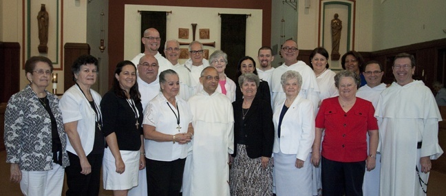 Father Bruno Cadoré poses with members of his Dominican family - priests and religious and their lay associates in South Florida - at the end of the Mass at Barry University.