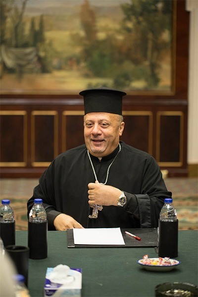 Father Nabil Haddad, director of the Jordanian Interfaith Coexistence Research Center, speaks about the Syrian crisis and a wide range of regional concerns Sept. 25 to an ecumenical group of Christian writers and bloggers from the U.S. who were convened at a Marriott Hotel in Amman.