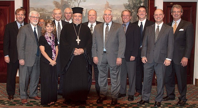 Father Nabil Haddad, director of the Jordanian Interfaith Coexistence Research Center, poses with an ecumenical group of Christian writers and bloggers from the U.S. who traveled to Jordan courtesy of the Jordan Travel Board.
