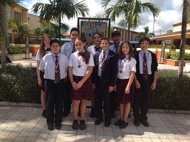 St. Brendan Elementary students who took medals home at the Christopher Columbus academic Olympics. Clockwise from top left: Rosemary Mendez (silver in mathematics), John Herrera (gold in art), Iliana Acosta (bronze in speech), Christian Cabrera (gold in speech), Diego Ruberte (bronze in English), Brittany Rizo (bronze in English), Louis Moya (bronze in religion), Giselle Mendoza (gold in Spanish) and Marco Congote (gold in science).