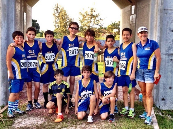 Our Lady of the Lakes' boys cross country team achieved top results and personal records during the last week of October. Front row, from left: Justin Espinosa, Michael Sanchez, Joseph Muniz; back row, from left: Brent Becerra, Daniel Quesada, Paolo Jebian, Miguel Palacios, Ian Cueli, David Espinosa, Ethan Cueli, and Coach Michelle Magoulas. 
Not pictured: Adam Magoulas, Joshua Kunkel, Jason Ravelo and Brandon Ravelo.