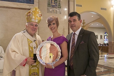 Archbishop Thomas Wenski gives the One in Faith award to Ana and Eddy Garcia of Immaculate Conception Parish in Hialeah. She is principal of Msgr. Edward Pace High School in Miami Gardens and he is principal of St. Louis Covenant School in Pinecrest.